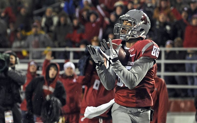 WSU wide receiver Marquess Wilson cradles his second touchdown pass during first half action against Arizona State in their game in Pullman, Saturday, Nov. 12, 2011. (Christopher Anderson / Spokesman-Review)