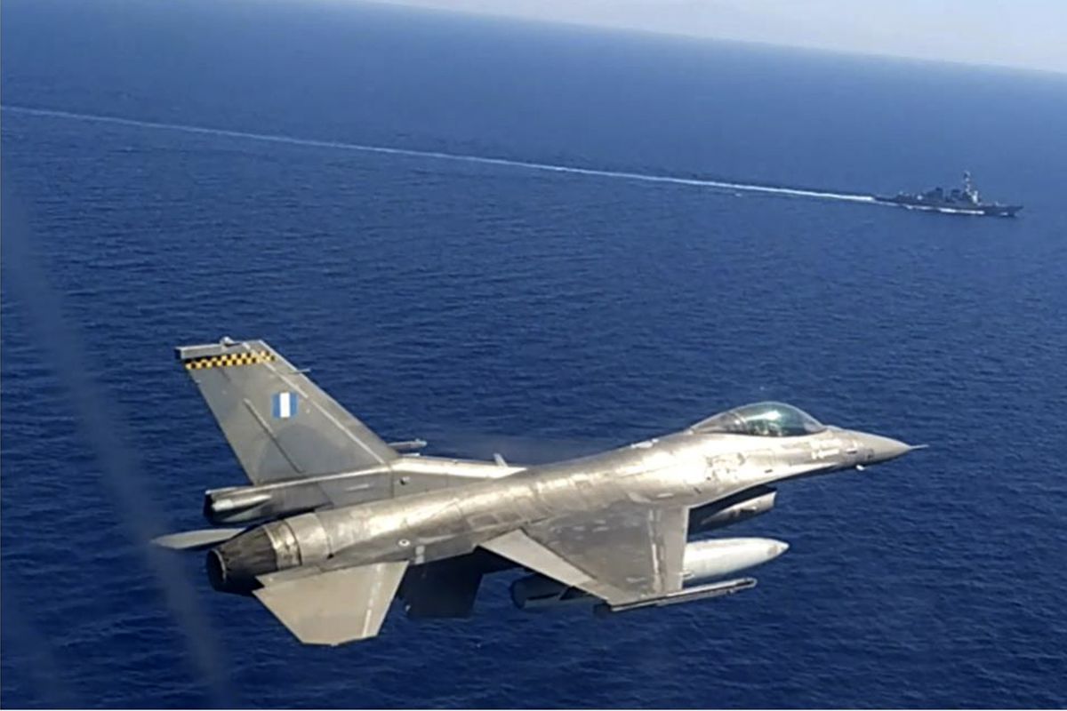 In this photo provided by the Greek National Defense Ministry, a Greek air force jet takes part in a Greek-US military exercise south of the island of Crete, on Monday, Aug. 24, 2020. Greece began a military exercise involving its navy and air force in the Mediterranean southeast of Crete and south of the Greek island of Kastellorizo, near an area where Turkey has sent research vessel Oruc Reis, accompanied by warships, to survey the seabed for gas and oil deposits.  (Uncredited)