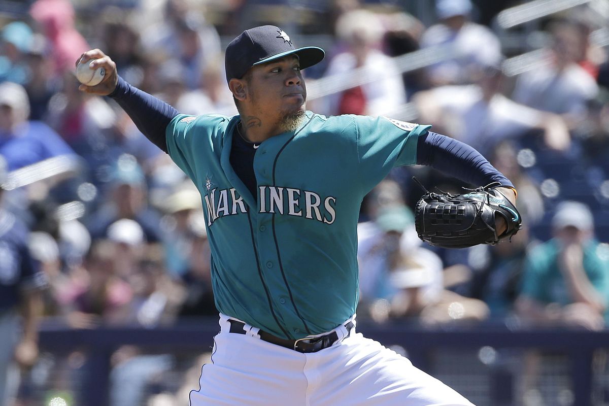 Seattle Mariners starting pitcher Felix Hernandez throws during a spring training baseball game against the San Diego Padres in Peoria, Ariz., on March 30, 2016. Through all the various remodels over the course of too many lost seasons there have been two constants among Seattle baseball for the past decade: Felix Hernandez and missing the playoffs. (Jeff Chiu / Associated Press)