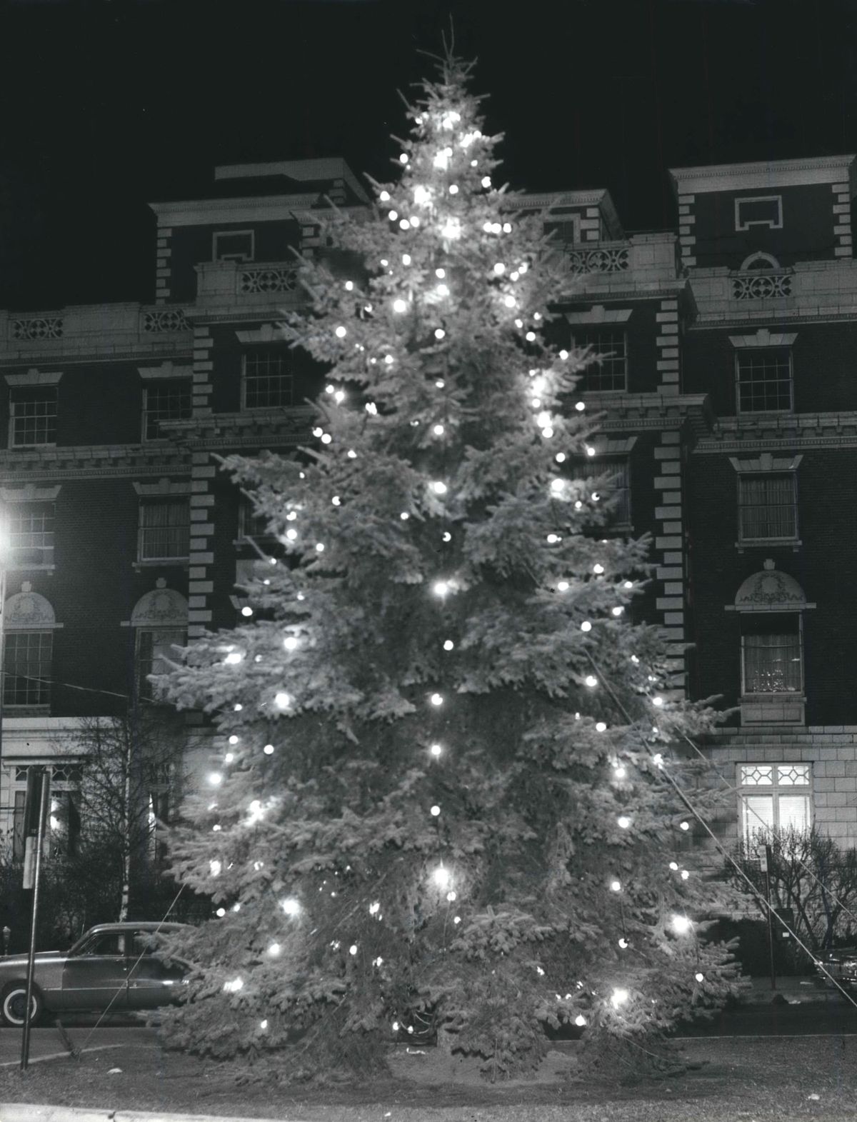 1960: Operation Christmas tree, a joint endeavor by the Junior Chamber of Commerce, aka the Jaycees, and the city of Spokane, is completed with a living blue spruce tree permanently planted in the median of Riverside Avenue. The Spokane Nurserymen’s association transplanted the tree from a donor’s property. Firefighters from Station 5 decked the tree with lights and decorations. The first tree died and was replaced in the early 1960s.  (SPOKESMAN-REVIEW PHOTO ARCHIVES)