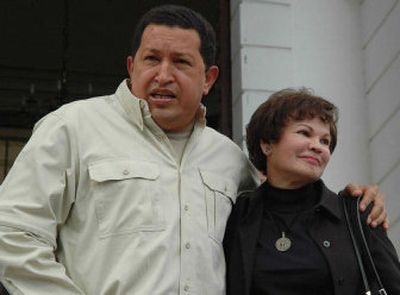 
Venezuelan President Hugo Chavez embraces Jenny Figueredo, a senior Venezuelan diplomat expelled from Washington last week, after a meeting at the presidential palace in Caracas on Friday. 
 (Associated Press / The Spokesman-Review)