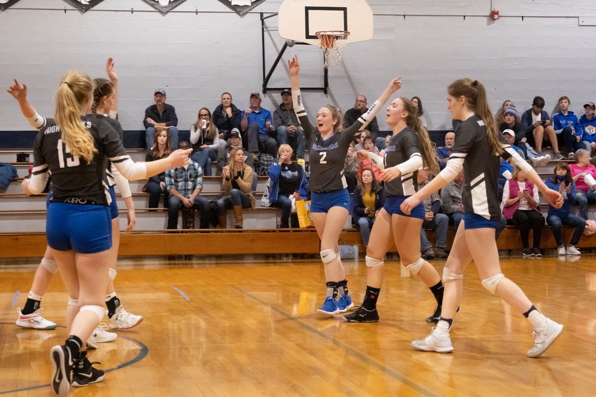 Oakesdale players celebrate after winning the first set against St. John-Endicott/LaCrosse on Oct. 26 in Oakesdale.  (Madison McCord/For The Spokesman-Review)
