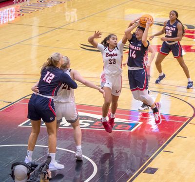 Gonzaga's Kaylynne Truong (14) looks for an outlet pass from the while being guarded by Eastern Eagle defender Jaydia Martin (23) Tuesday, Dec. 21, 2021 in a non-conference game between EWU and Gonzaga. Gonzaga triumphed over the Eagles 76-48.  (JESSE TINSLEY/THE SPOKESMAN-REVIEW)