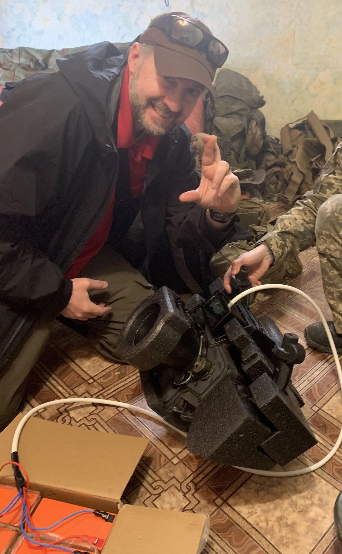 Mark Hayward, in the Mykolaiv area in late March, prepares to test an exterior battery pack prototype for the Javelin.    (Mark Hayward/Handout)