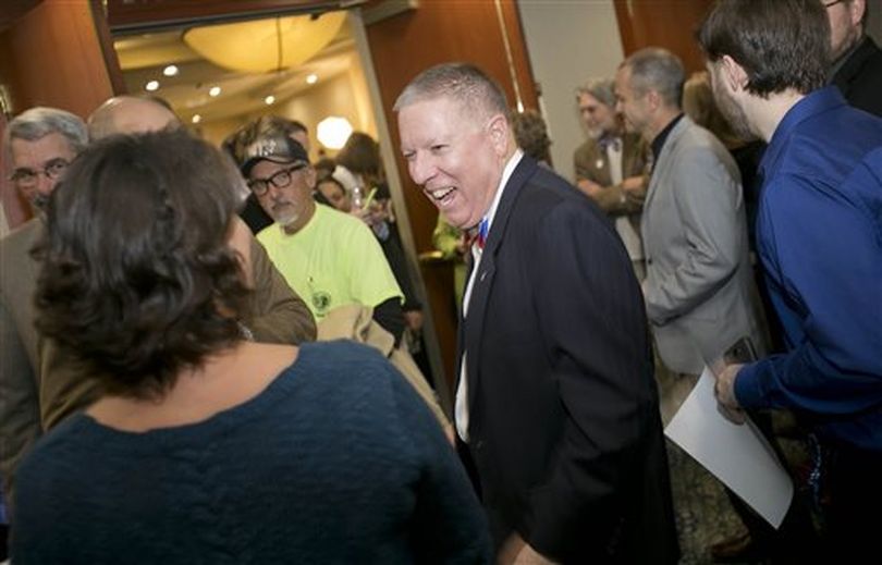 A.J. Balukoff, running for Idaho governor, laughs with attendees of a Democratic election night party at The Grove Hotel in Boise, Idaho, Tuesday Nov. 4, 2014. (AP/Idaho Statesman)