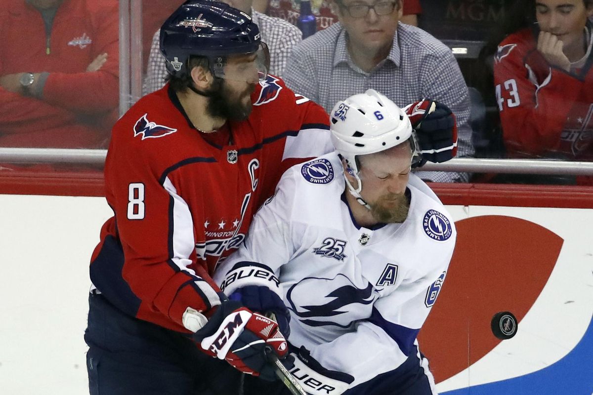 Washington Capitals left wing Alex Ovechkin (8), from Russia, collides with Tampa Bay Lightning defenseman Anton Stralman (6), from Sweden, during the third period of Game 6 of the NHL Eastern Conference finals hockey playoff series, Monday, May 21, 2018, in Washington. The Capitals won 3-0. (Alex Brandon / Associated Press)