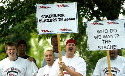 
Fans outside Blazers' practice facility chant 
