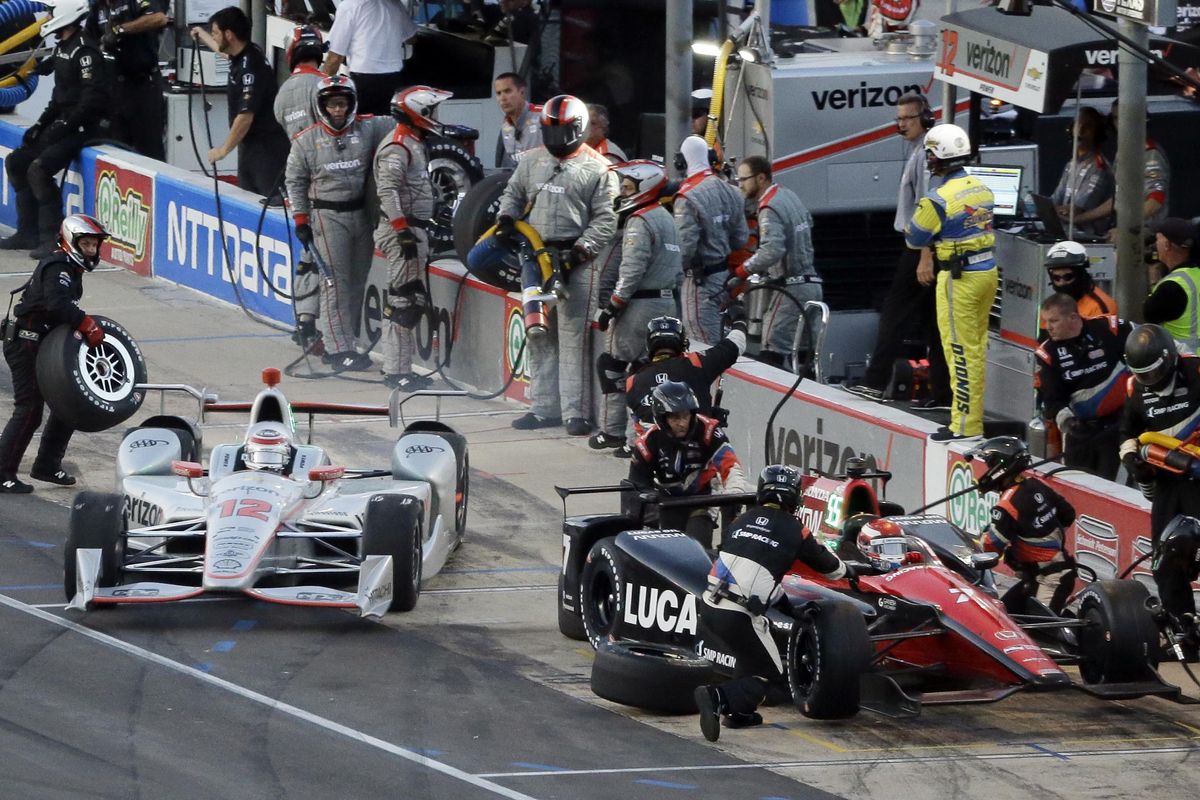 Will Power (12), of Australia, speeds out of his stall after a pit stop past Mikhail Aleshin (7), of Russia, during an IndyCar auto race at Texas Motor Speedway, Saturday, June 10, 2017, in Fort Worth, Texas. (Tony Gutierrez / Associated Press)