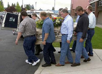 
The remains of Spokane worker Mike Cmos Jr. are carried to a hearse after Monday's memorial at Calvary Chapel. Cmos died May 10 when a sewage tank roof he was on collapsed. The remains of Spokane worker Mike Cmos Jr. are carried to a hearse after Monday's memorial at Calvary Chapel. Cmos died May 10 when a sewage tank roof he was on collapsed. 
 (Colin Mulvany/Colin Mulvany/ / The Spokesman-Review)