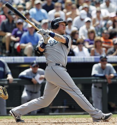  Mike Carp's solo home run in the sixth inning was one of three home runs the Mariners hit on Sunday.
  (David Zalubowski / Associated Press)