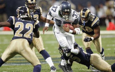 
Seahawks running back Shaun Alexander picked through the St. Louis defense on Sunday. 
 (Associated Press / The Spokesman-Review)