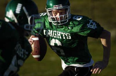 
East Valley High School senior quarterback Lonnie Quirk runs on a play at  practice. Quirk is one five GSL quarterbacks to throw for more than 1,000 yards.
 (Holly Pickett / The Spokesman-Review)
