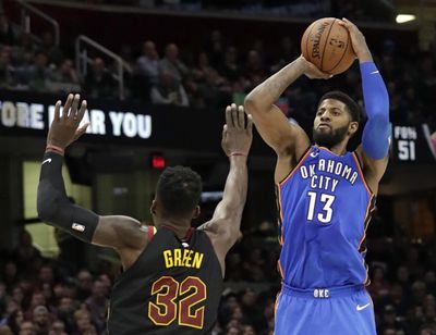 Oklahoma City Thunder's Paul George (13) shoots over Cleveland Cavaliers' Jeff Green (32) in the second half of an NBA basketball game, Saturday, Jan. 20, 2018, in Cleveland. The Thunder won 148-124. (Tony Dejak / AP)