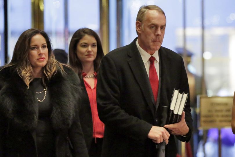 Rep. Ryan Zinke, right, R-Mont., arrives in Trump Tower, in New York, Monday, Dec. 12, 2016. (Richard Drew / Associated Press)