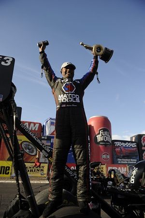 Antron Brown celebrates his NHRA Full Throttle Drag Racing Series Top Fuel victory at the 2012 Arizona Nationals. (Photo courtesy of NHRA)