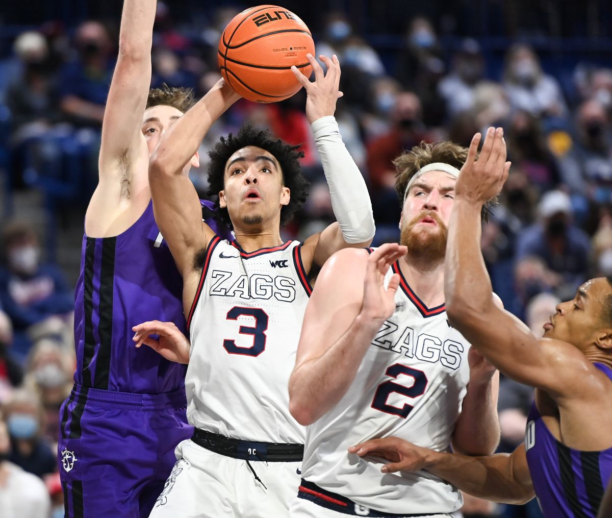 Gonzaga Bulldogs guard Andrew Nembhard (3) drives to the basket and scores against the Portland Pilots during the second half of a college basketball game on Saturday, Jan 29, 2022, at McCarthey Athletic Center in Spokane, Wash. Goznaga won the game 104-72.  (Tyler Tjomsland/The Spokesman-Review)