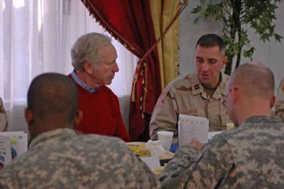 In this photo made available by the Army, Sen. Joseph Lieberman, left, listens as Capt. Daniel Fitch describes his deployment to Iraq as part of Task Force Baghdad during Thanksgiving at Camp Liberty in Baghdad.
(Associated Press / The Spokesman-Review)