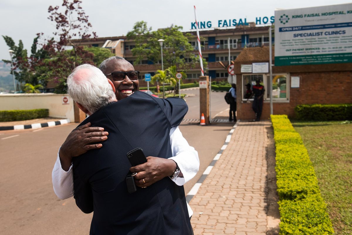 Dr. Joseph Mucumbitsi greets Dr. Hal Goldberg in front of King Faisal Hospital in Kigali, Rwanda. Mucumbitsi invited Goldberg to Rwanda in 2008, and the two have continued their partnership since. (Rajah Bose / Special to The Spokesman-Review)