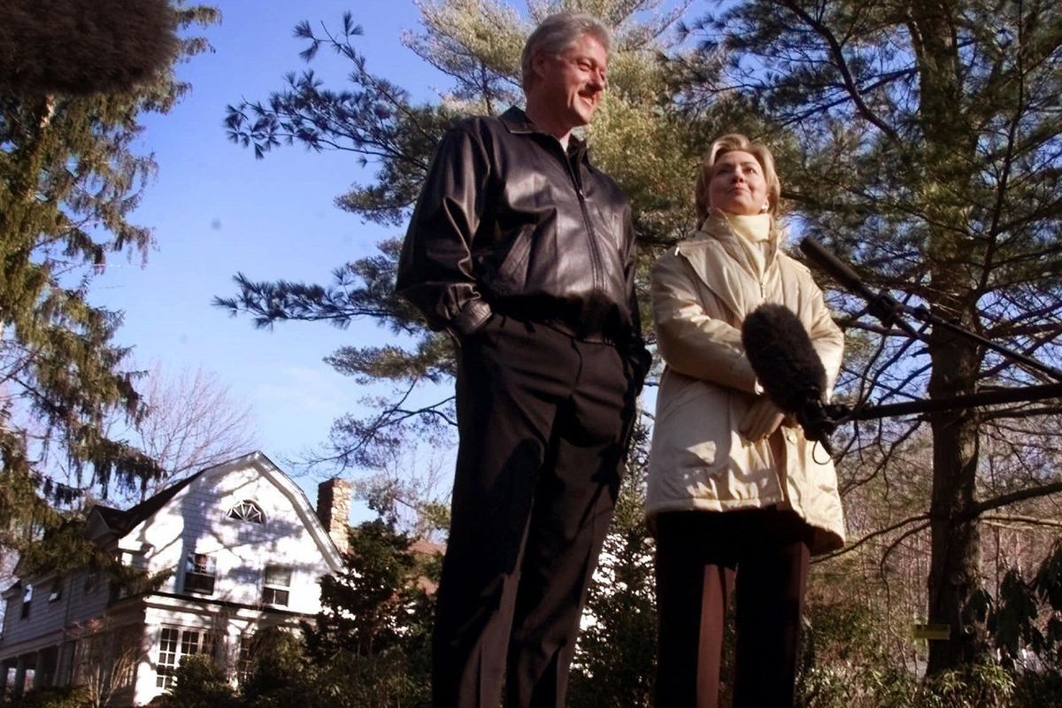 FILE - In this Jan. 6, 2000 file photo, Bill and Hillary Clinton stand in the driveway of their new home in Chappaqua, N.Y. A U.S. official says a “functional explosive device” was found at Hillary and Bill Clinton’s suburban New York home. (AP)