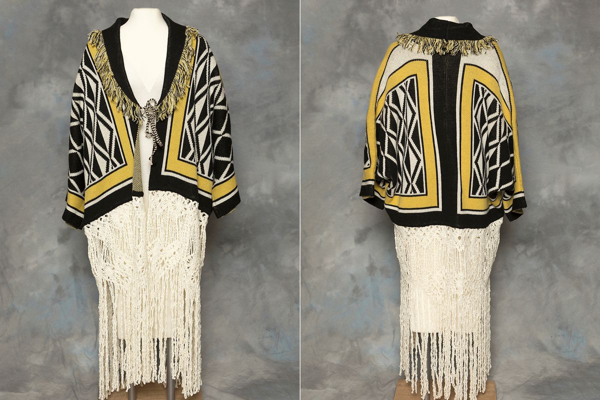 This combination of photos provided by the Sealaska Hertiage Institute in Juneau, Alaska, shows the front and back of a Tlingit Ravenstail coat. An Alaska Native cultural organization and the luxury department store Neiman Marcus have settled a lawsuit over the sale of a coat with a copyrighted, geometric design borrowed from indigenous culture.  (Brian Wallace)