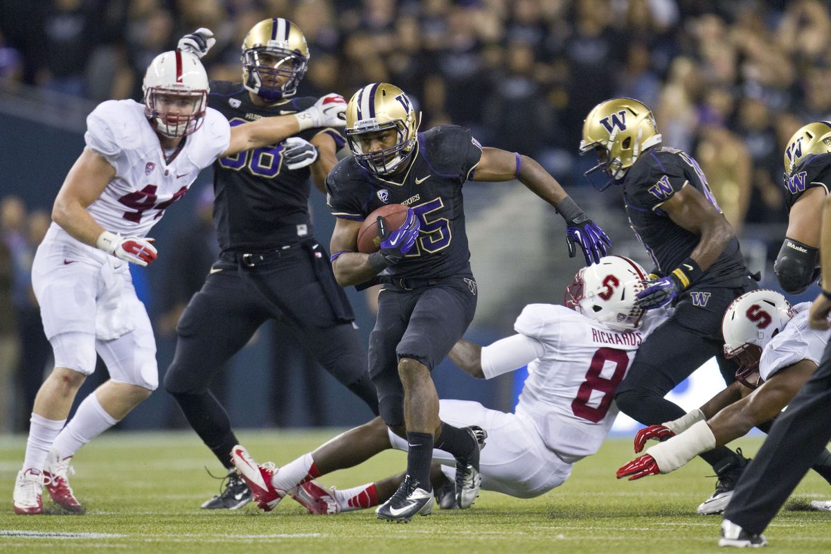 Bishop Sankey takes off for 61-yard TD run for UW. (Associated Press)