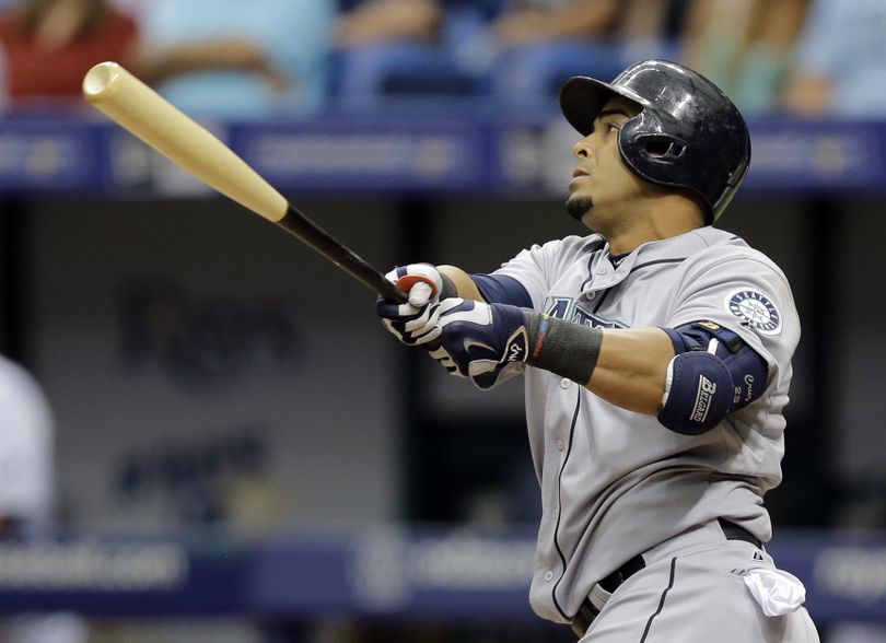 Seattle Mariners' Nelson Cruz follows the flight of his three-run home run in the ninth inning on Wednesday. (AP)
