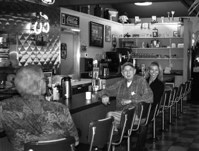 
Route 53 Diner owner Julie Simpson, right, sits with one of her regular customers, Slim Dossey, a one-time member of the Sons of the Pioneers and Sons of the Golden West. 
 (Photo courtesy Mary Jane Honegger / The Spokesman-Review)