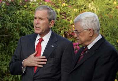 
President Bush stands with Palestinian Authority President  Mahmoud Abbas on Saturday after their meeting in Egypt.  Associated Press
 (Associated Press / The Spokesman-Review)