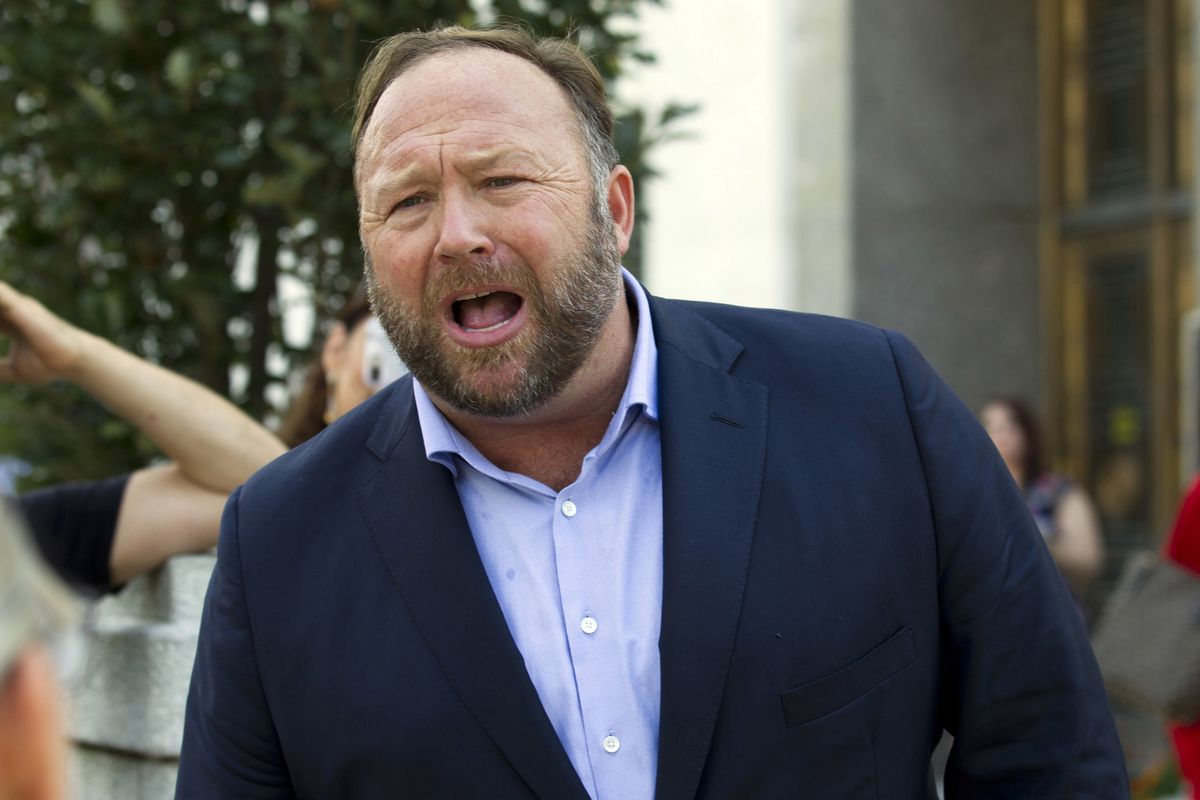 FILE- In this Sept. 5, 2018, file photo Alex Jones speaks outside of the Dirksen building of Capitol Hill in Washington. The U.S. Supreme Court on Monday, April 5, 2021, declined to hear an appeal by the Infowars host and conspiracy theorist, who was fighting a Connecticut court sanction in a defamation lawsuit brought by relatives of some of the victims of the Sandy Hook Elementary School shooting.  (Jose Luis Magana)