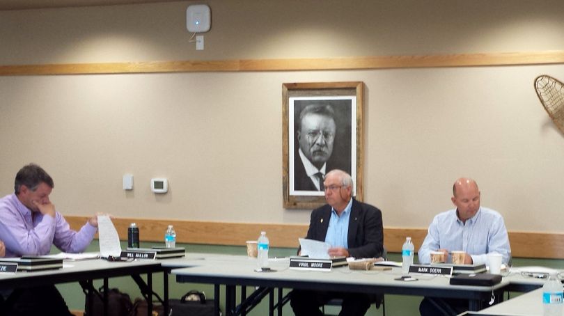 Idaho Fish & Game Director Virgil Moore, center, is flanked by Commissioner Mark Doerr of Twin Falls, right, and commissioner Will Naillon, left, at the panel's May meeting in Coeur d'Alene.  (Rich Landers)