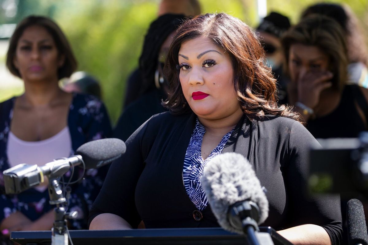 Sonia Joseph, mother of Giovonn Joseph-McDade, a Black man killed by Kent police in 2017, holds a news conference flanked by family and supporters to discuss their $4.4 million settlement with the city at Canterbury Park in Kent on Thursday.  (Bettina Hansen/Seattle Times)