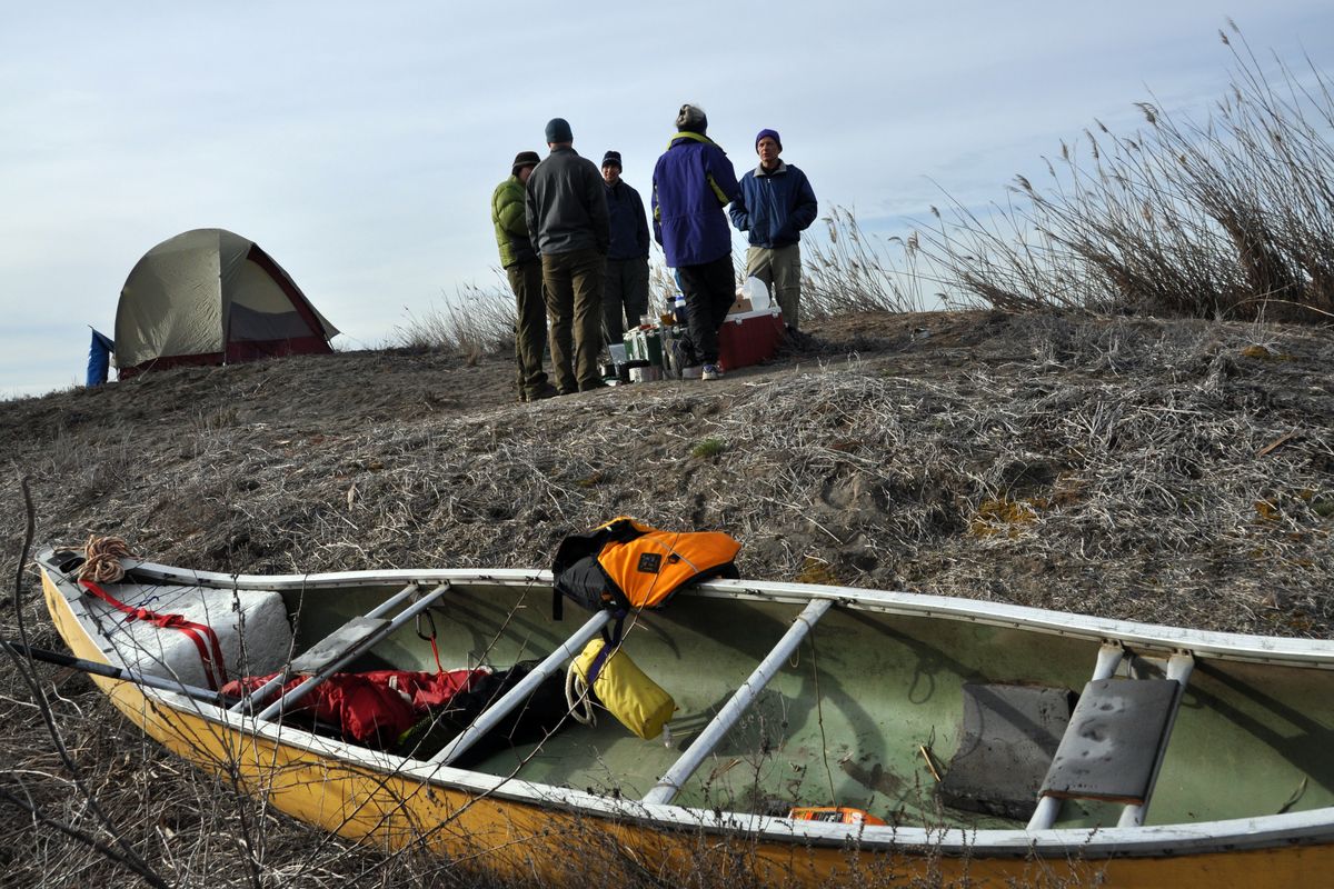 Paddlers make camp on a sand dune halfway through their 25-mile wasteway trip.