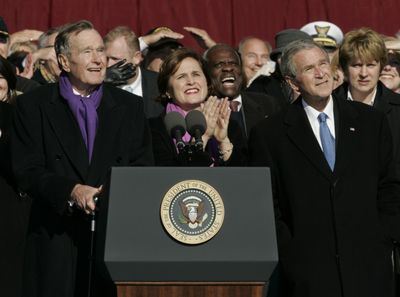 President Bush, right, watches a fly-by along with his father, former President George H.W. Bush, and ship sponsor Dorothy Bush Koch during commissioning  of the USS George H.W. Bush.  (Associated Press / The Spokesman-Review)