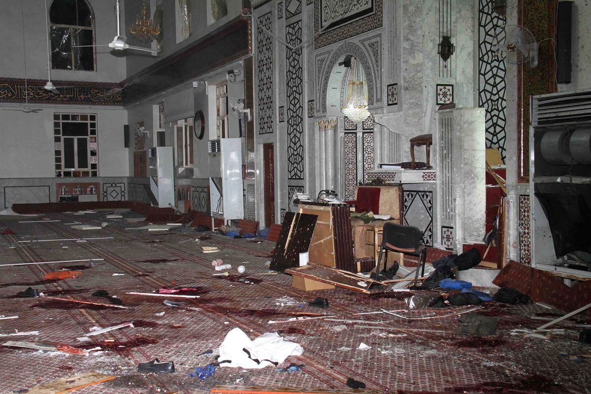 In this photo released by the Syrian official news agency SANA, the Eman Mosque in Damascus is seen destroyed after a suicide bomber blew himself up on Thursday. (Associated Press)