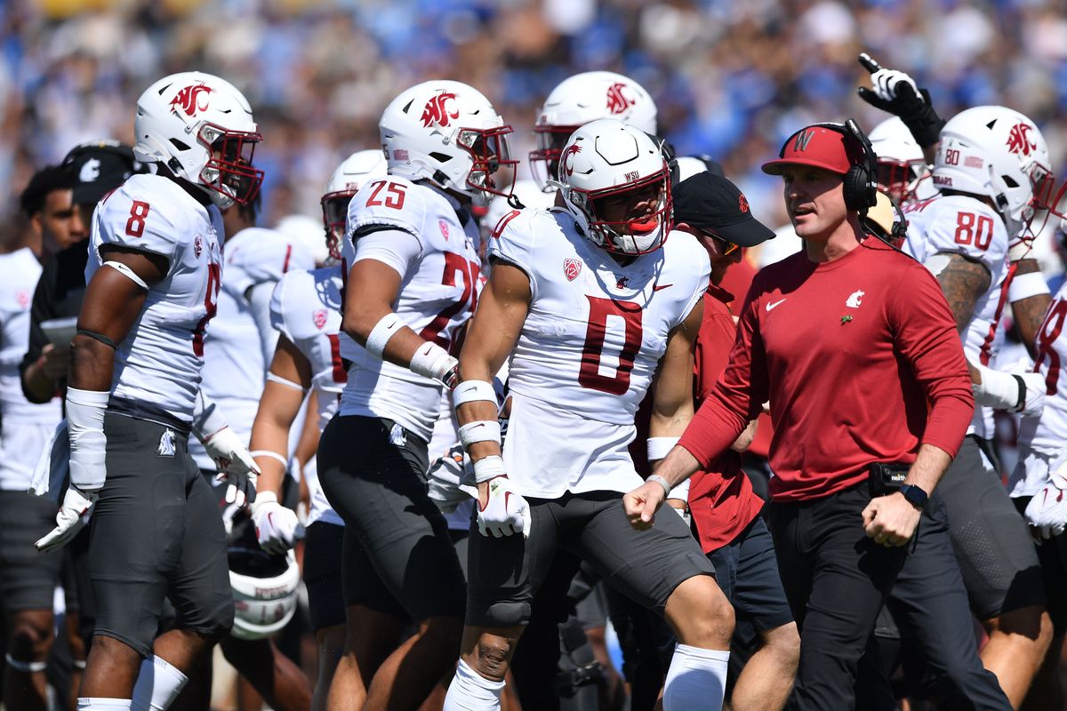 Washington State defensive back Sam Lockett III (0) celebrates an interception during the first half Saturday at the Rose Bowl in Pasadena, Calif.  (Tyler Tjomsland/The Spokesman-Review)