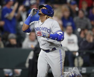 Toronto Blue Jays’ Vladimir Guerrero Jr. gestures as he circles the bases after hitting a solo home run off Colorado Rockies relief pitcher Chris Rusin during the eighth inning of a baseball game Friday, May 31, 2019, in Denver. (David Zalubowski / Associated Press)