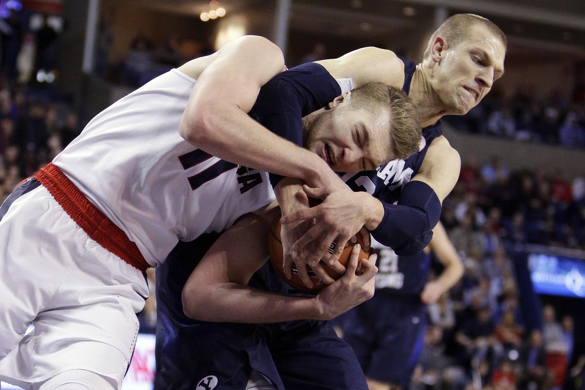 Gonzaga’s Domantas Sabonis (11) and BYU’s Nate Austin go after a rebound during the first half of an NCAA college basketball game, Thursday, Jan. 14, 2016, in Spokane. (Associated Press)