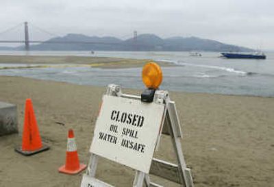
A beach at Crissy Field remains closed after   about 58,000 gallons of oil were spilled into the San Francisco Bay  when a container ship hit a Bay Bridge support tower on  Wednesday. Associated Press photos
 (Associated Press photos / The Spokesman-Review)