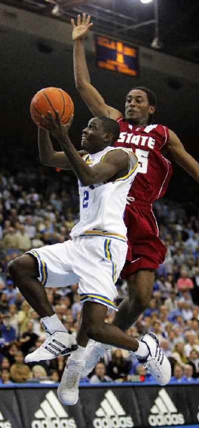 
WSU's Kyle Weaver, attempting to block a shot by UCLA's Darren Collison, knows defense will not be abandoned under new coach Tony Bennett.
 (Associated Press / The Spokesman-Review)