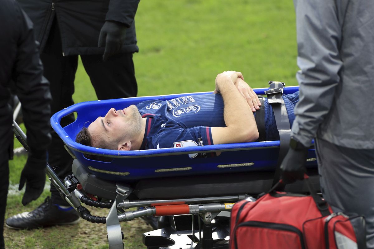 Swansea City’s Jordan Morris is stretchered off the field after getting hurt during a Sky Bet Championship soccer match against Huddersfield, Saturday, Feb. 20, 2021, at John Smith’s Stadium in Huddersfield, England. (Mike Egerton)