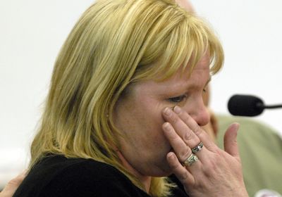 Speaking before lawmakers in Olympia on Monday, Debi Hammel wipes away tears as she recounts the death of her daughter.  (Richard Roesler / The Spokesman-Review)