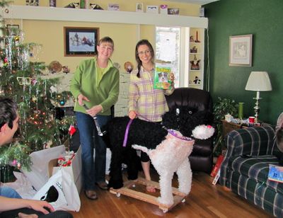 This 2010 photo provided by Katie Jackson shows Jackson, right, and her aunt Margaret Smith, with a stuffed dog Jackson received for Christmas in Lewistown, Mont. For three years, Jackson has asked for a Leonberger, a gentle giant breed that can cost up to $1,500. (Associated Press)