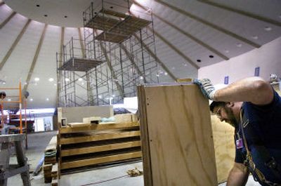 
Carpenter Perry Charbonneau  constructs a counter for a  food vendor in the Spokane International Airport's rotunda Monday. Security improvements will be finished this week, but food and beverage areas won't be ready  until mid-December. 
 (Holly Pickett / The Spokesman-Review)