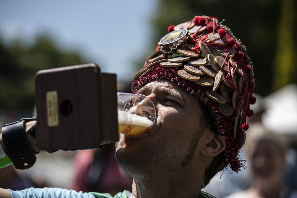Brain Kidd drinks the first beer from the tapping of ceremonial keg at the Oregon Brewers Festival at Tom McCall Waterfront Park in Portland on July 24, 2019.  (Noble Guyon/Oregonian)
