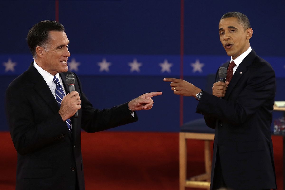 In this Oct. 16, 2012 file photo, Republican presidential candidate, former Massachusetts Gov. Mitt Romney and President Barack Obama spar during the second presidential debate at Hofstra University in Hempstead, N.Y. (Charlie Neibergall / Associated Press)