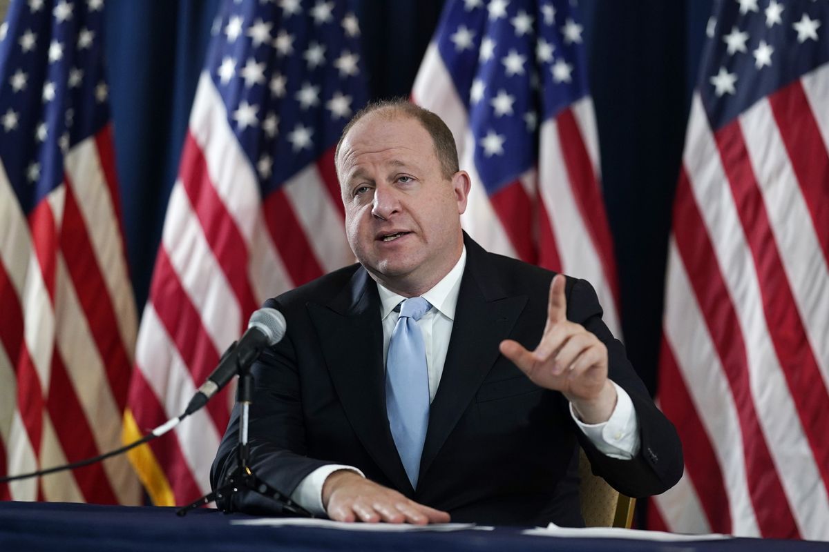 Colorado Gov. Jared Polis speaks during a news conference about the state’s response to the rapid increase in COVID-19 cases on Tuesday in Denver.  (David Zalubowski)