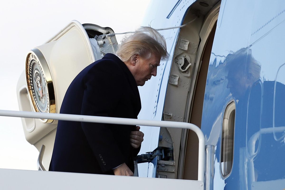 President Donald Trump boards Air Force One, Friday, Feb. 2, 2018, in Andrews Air Force Base, Md., en route to Palm Beach International Airport, in West Palm Beach, Fla. (Carolyn Kaster / Associated Press)