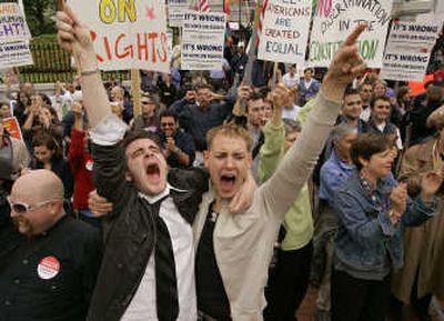 
Greg Kimball, left,  and his partner Brian O'Connor celebrate Thursday after Massachusetts lawmakers killed a vote on gay marriage.Associated Press
 (Associated Press / The Spokesman-Review)