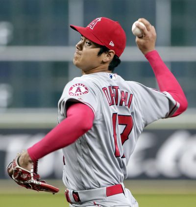 Los Angeles Angels starting pitcher Shohei Ohtani (17) throws against the Houston Astros during the first inning of a baseball game Sunday, Sep. 2, 2018, in Houston. (Michael Wyke / Associated Press)