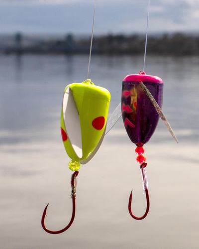 Anglers in Washington may soon be able to use barbed hooks, like the one on the left, while fishing for salmon, steelhead and other species, according to a move made by the Washington Fish and Wildlife Commission. (Pete Caster / The Lewiston Tribune)